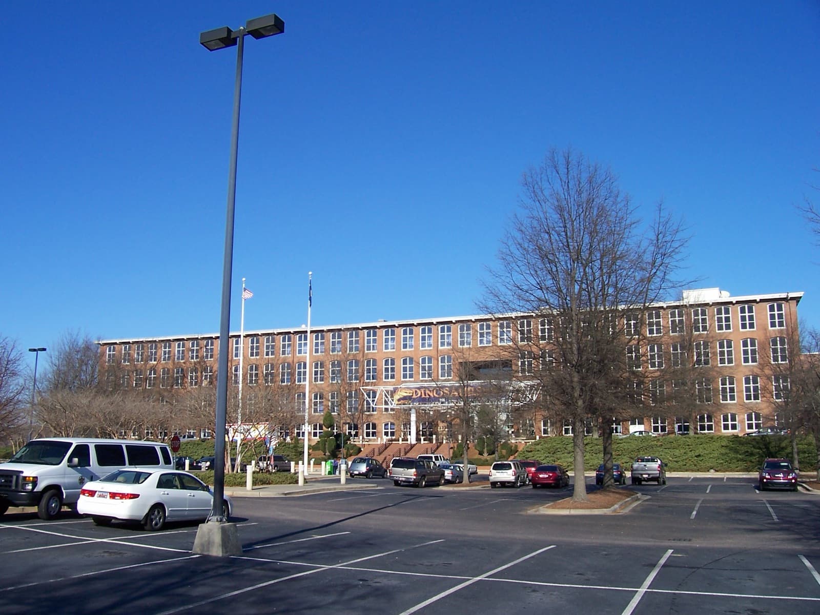 Brick exterior of the South Carolina State Museum in Columbia, viewed across its parking area