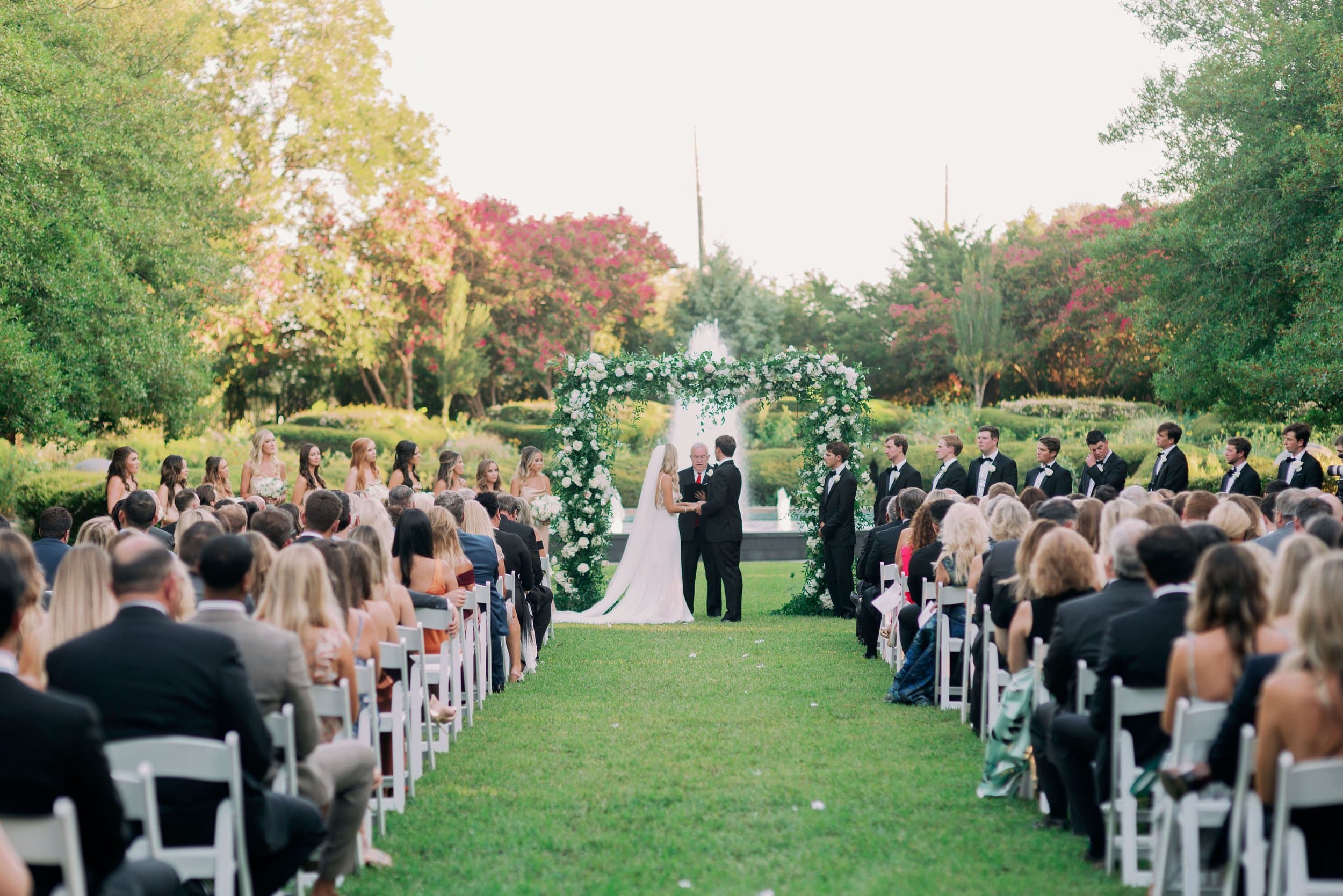 An outdoor wedding ceremony in a garden at Texas Discovery Gardens
