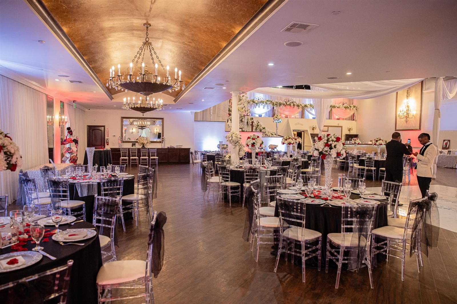 A Pelazzio ballroom set with tables and floral decor