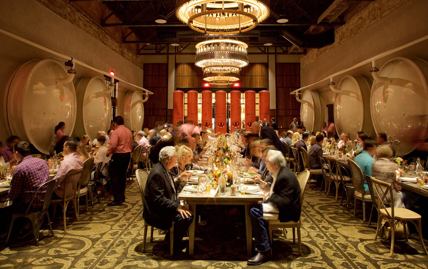 Dinner in Hotel Emma's Elephant Cellar beneath circular chandeliers and historic brewery tanks