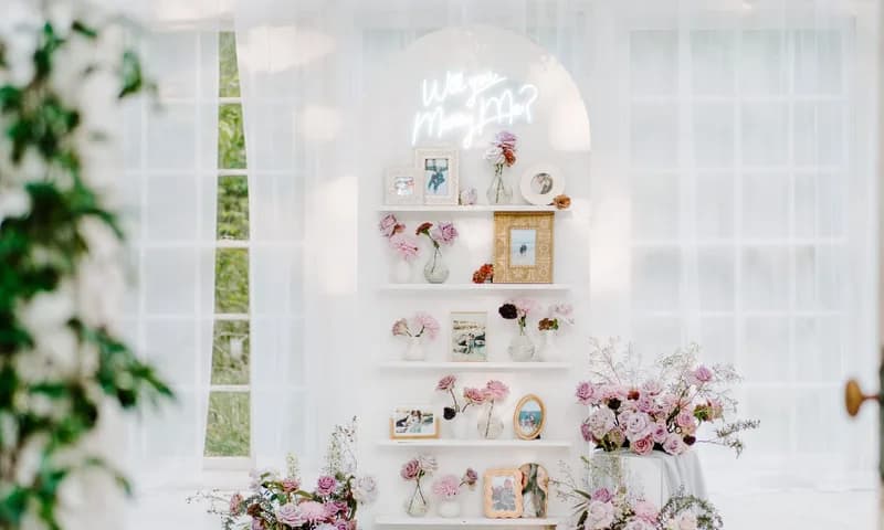 White conservatory with a table set for a wedding