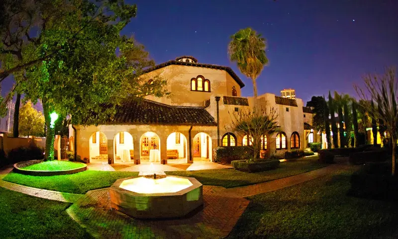 The Parador building and grounds lit at night