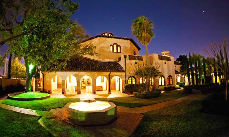 The Parador building and grounds lit at night